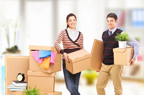 Professional movers carrying furniture in Stockwell