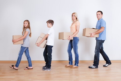 Professional movers packing household items for removal services in Stockwell